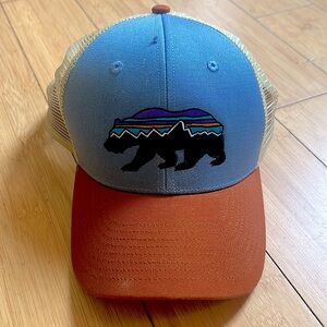 Patagonia trucker hat with bear logo, barely worn.